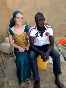 Abou and I at the naming ceremony of his newborn son. His village only speaks Wolof so it sucks going there... Good thing he's worth visiting